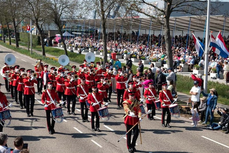 Amsterdam: Day Trip to Flower Parade & Keukenhof on April 18 - Watching the Flower Parade from a grandstand