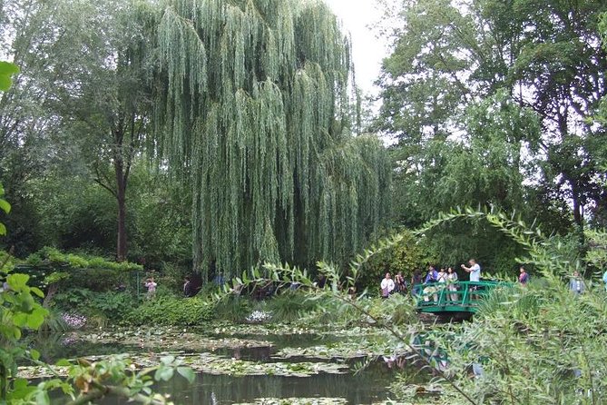Giverny Small-Group Minivan with Hotel Pickup or Meeting Point - Adding the church, grave, and village