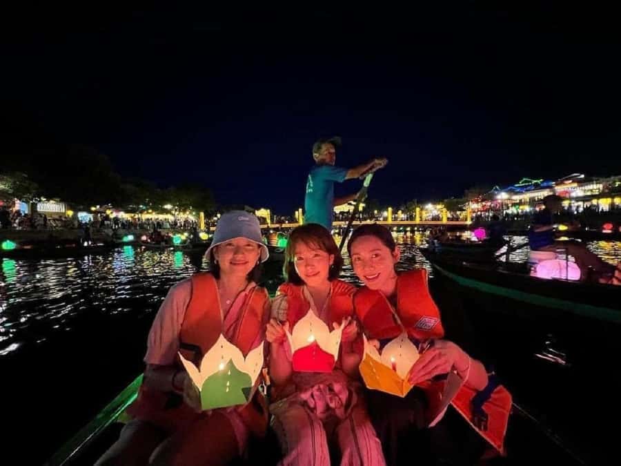 Hoi An: Boat Ride on Hoai River & Release the Flower Lantern - Boarding a wooden boat on the Thu Bồn River