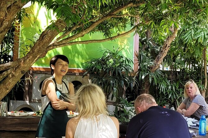 Hue's Vegetarian Cooking Class in Ancient Garden - Folding An Nhien rolls with the chef