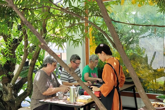 Hue's Vegetarian Cooking Class in Ancient Garden - Walking through 50-plus outdoor artworks