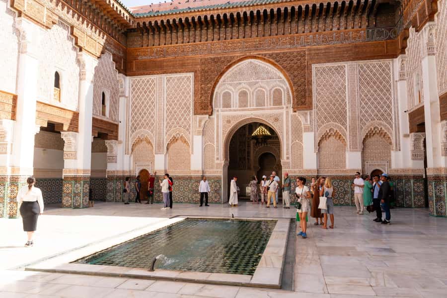 Marrakech: Madrassa Ben Youssef, Secret Garden & Medina Tour - Returning through the Medina to Jemaa el Fna