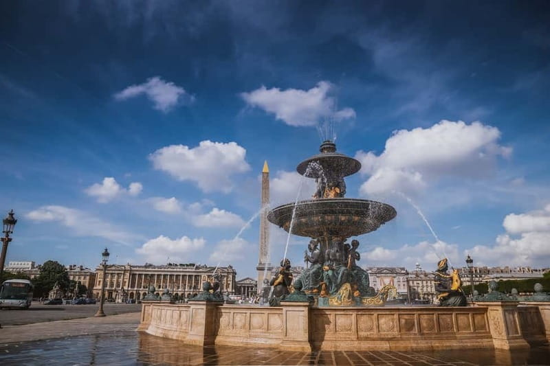 Paris: Louvre Museum Entry Ticket and Garden Walking Tour - Passing Under the Arc de Triomphe du Carrousel