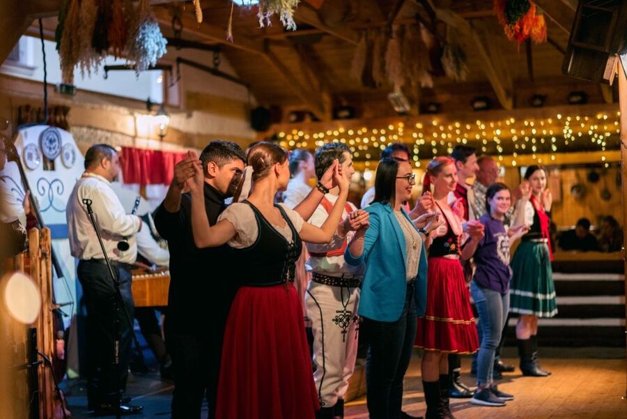 Prague: Evening Folklore Garden Party with Traditional Menu - The folk show gets the room involved
