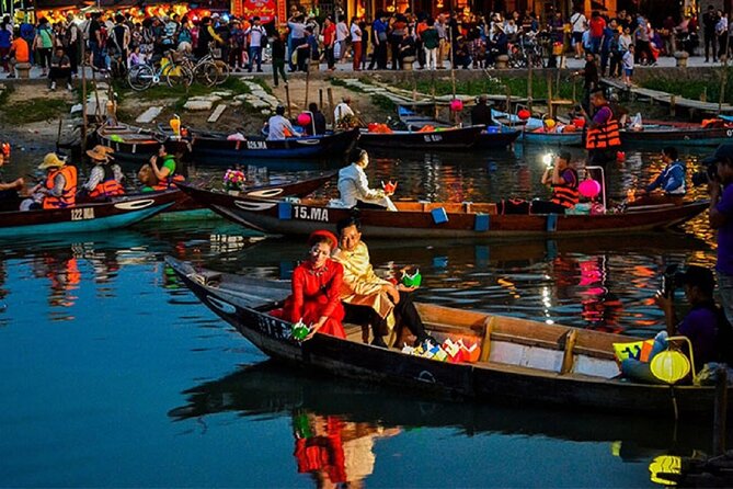 River Boat Ride by Night with Drop Flower Lantern in Hoi An - Releasing your flower lantern into the river