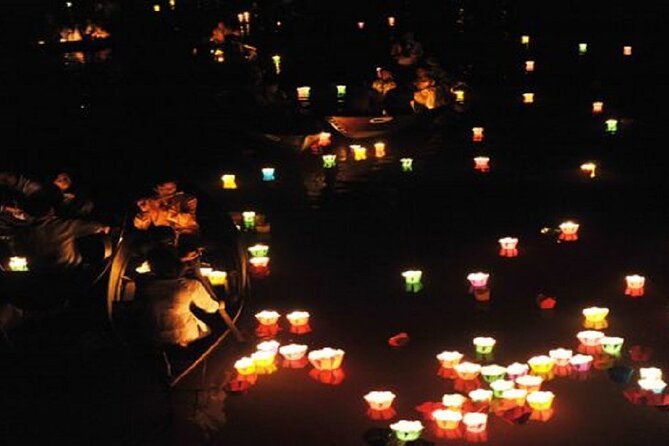 River Boat Ride by Night with Drop Flower Lantern in Hoi An - Boarding a wooden boat on the Hoai River