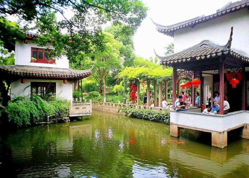 Shanghai: Zhujiajiao Private Tour w/ Boat Ride & Garden - Stone lanes, market stalls, and local snacks