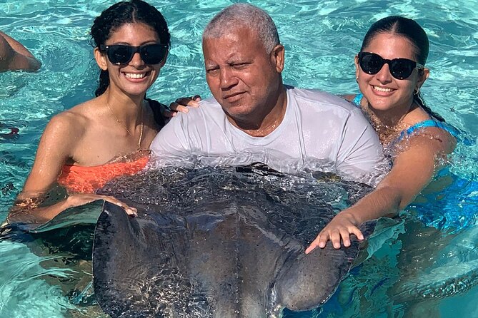 StingrayCity ,Coral Garden & Starfish Tour. - Starfish Point in shallow water